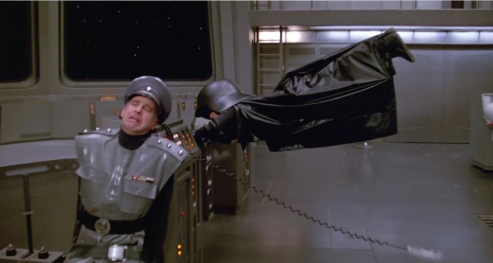 Funny Image of Dark Helmat from Spaceballs hanging on to the spaceship as it's traveling at ludicrous speed.